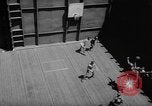 Image of basketball court on aircraft carrier hangar deck Pacific Ocean, 1945, second 23 stock footage video 65675055308
