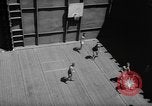 Image of basketball court on aircraft carrier hangar deck Pacific Ocean, 1945, second 24 stock footage video 65675055308