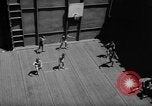 Image of basketball court on aircraft carrier hangar deck Pacific Ocean, 1945, second 25 stock footage video 65675055308