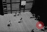 Image of basketball court on aircraft carrier hangar deck Pacific Ocean, 1945, second 26 stock footage video 65675055308