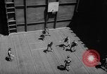 Image of basketball court on aircraft carrier hangar deck Pacific Ocean, 1945, second 27 stock footage video 65675055308