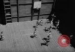 Image of basketball court on aircraft carrier hangar deck Pacific Ocean, 1945, second 28 stock footage video 65675055308