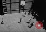 Image of basketball court on aircraft carrier hangar deck Pacific Ocean, 1945, second 29 stock footage video 65675055308