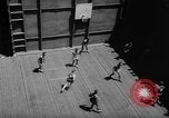 Image of basketball court on aircraft carrier hangar deck Pacific Ocean, 1945, second 30 stock footage video 65675055308