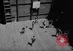 Image of basketball court on aircraft carrier hangar deck Pacific Ocean, 1945, second 31 stock footage video 65675055308