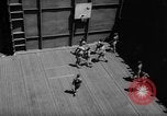 Image of basketball court on aircraft carrier hangar deck Pacific Ocean, 1945, second 32 stock footage video 65675055308