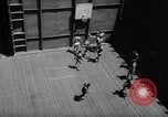 Image of basketball court on aircraft carrier hangar deck Pacific Ocean, 1945, second 33 stock footage video 65675055308