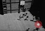 Image of basketball court on aircraft carrier hangar deck Pacific Ocean, 1945, second 34 stock footage video 65675055308