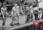 Image of basketball court on aircraft carrier hangar deck Pacific Ocean, 1945, second 54 stock footage video 65675055308