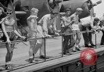 Image of basketball court on aircraft carrier hangar deck Pacific Ocean, 1945, second 56 stock footage video 65675055308
