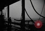 Image of man on the deck Pacific Ocean, 1944, second 3 stock footage video 65675055311