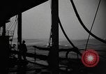 Image of man on the deck Pacific Ocean, 1944, second 4 stock footage video 65675055311