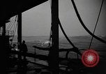 Image of man on the deck Pacific Ocean, 1944, second 5 stock footage video 65675055311