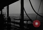 Image of man on the deck Pacific Ocean, 1944, second 6 stock footage video 65675055311
