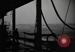 Image of man on the deck Pacific Ocean, 1944, second 7 stock footage video 65675055311