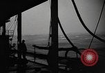 Image of man on the deck Pacific Ocean, 1944, second 8 stock footage video 65675055311