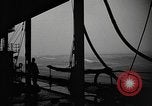 Image of man on the deck Pacific Ocean, 1944, second 10 stock footage video 65675055311