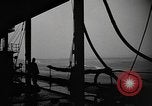 Image of man on the deck Pacific Ocean, 1944, second 11 stock footage video 65675055311