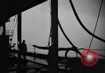 Image of man on the deck Pacific Ocean, 1944, second 16 stock footage video 65675055311