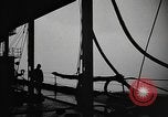 Image of man on the deck Pacific Ocean, 1944, second 35 stock footage video 65675055311