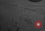 Image of burning TBF Avenger Pacific Ocean, 1945, second 25 stock footage video 65675055312