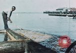 Image of man spreads grease on ways at Newport News Shipyard Newport News Virginia USA, 1943, second 5 stock footage video 65675055340