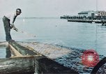 Image of man spreads grease on ways at Newport News Shipyard Newport News Virginia USA, 1943, second 6 stock footage video 65675055340