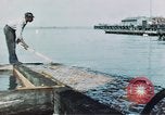 Image of man spreads grease on ways at Newport News Shipyard Newport News Virginia USA, 1943, second 7 stock footage video 65675055340