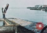 Image of man spreads grease on ways at Newport News Shipyard Newport News Virginia USA, 1943, second 9 stock footage video 65675055340