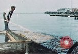 Image of man spreads grease on ways at Newport News Shipyard Newport News Virginia USA, 1943, second 10 stock footage video 65675055340