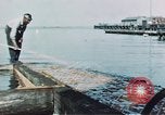 Image of man spreads grease on ways at Newport News Shipyard Newport News Virginia USA, 1943, second 11 stock footage video 65675055340