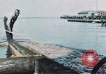 Image of man spreads grease on ways at Newport News Shipyard Newport News Virginia USA, 1943, second 12 stock footage video 65675055340