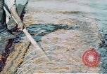 Image of man spreads grease on ways at Newport News Shipyard Newport News Virginia USA, 1943, second 15 stock footage video 65675055340