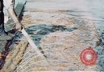 Image of man spreads grease on ways at Newport News Shipyard Newport News Virginia USA, 1943, second 23 stock footage video 65675055340