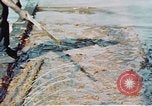 Image of man spreads grease on ways at Newport News Shipyard Newport News Virginia USA, 1943, second 26 stock footage video 65675055340