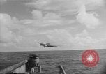 Image of F6F hellcats take off from the USS Hancock Pacific Ocean, 1944, second 11 stock footage video 65675055348