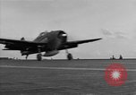 Image of Navy F6F aircraft take off from USS Hancock Pacific Ocean, 1944, second 27 stock footage video 65675055349