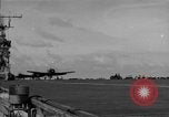 Image of Navy F6F aircraft take off from USS Hancock Pacific Ocean, 1944, second 36 stock footage video 65675055349