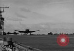 Image of Navy F6F aircraft take off from USS Hancock Pacific Ocean, 1944, second 37 stock footage video 65675055349