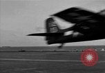 Image of Navy F6F aircraft take off from USS Hancock Pacific Ocean, 1944, second 41 stock footage video 65675055349