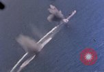 Standbild Flugzeuge aus USS Cowpens (CVL-25) Angriff japanischer Kreuzer Naka Pacific Theater, 1944, aus Sekunde 30 historischem Filmmaterial Videoclip 65675055351