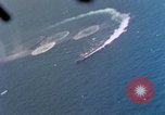 Standbild Flugzeuge aus USS Cowpens (CVL-25) Angriff japanischer Kreuzer Naka Pacific Theater, 1944, aus Sekunde 58 historischem Filmmaterial Videoclip 65675055351