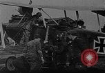 Image of Loading bombs in cockpit of German airplane France, 1917, second 4 stock footage video 65675055374