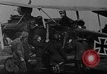 Image of Loading bombs in cockpit of German airplane France, 1917, second 6 stock footage video 65675055374