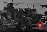 Image of Loading bombs in cockpit of German airplane France, 1917, second 10 stock footage video 65675055374