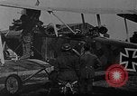 Image of Loading bombs in cockpit of German airplane France, 1917, second 11 stock footage video 65675055374