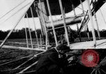 Image of Crowd gathered to watch Wright Flyer airplane demonstration in Le Mans France Le Mans France, 1908, second 10 stock footage video 65675055378