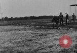Image of Crowd gathered to watch Wright Flyer airplane demonstration in Le Mans France Le Mans France, 1908, second 20 stock footage video 65675055378