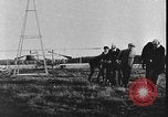 Image of Crowd gathered to watch Wright Flyer airplane demonstration in Le Mans France Le Mans France, 1908, second 32 stock footage video 65675055378