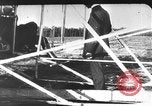 Image of Crowd gathered to watch Wright Flyer airplane demonstration in Le Mans France Le Mans France, 1908, second 38 stock footage video 65675055378